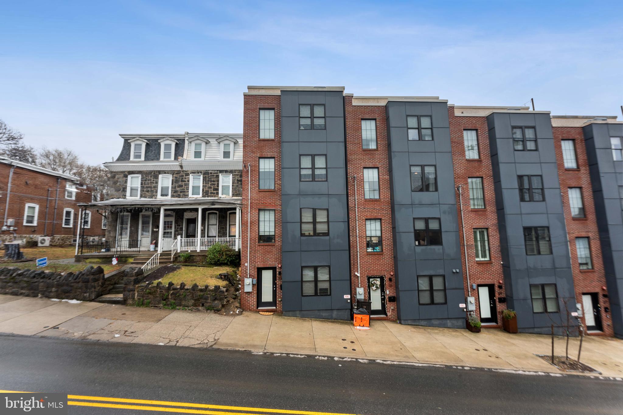 Modern townhomes beside classic architecture.