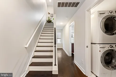 a view of a hallway with washer and dryer