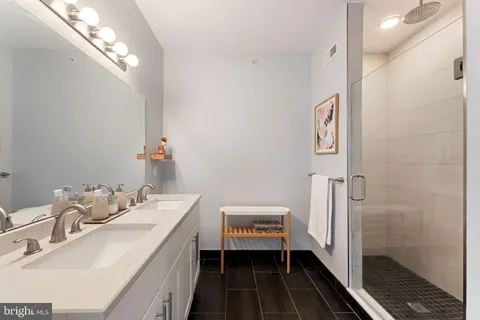 a bathroom with a sink and mirror