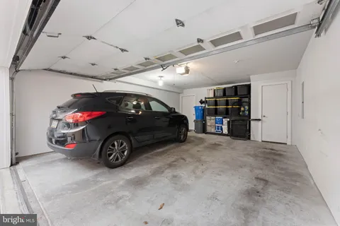 a view of a garage with parked cars