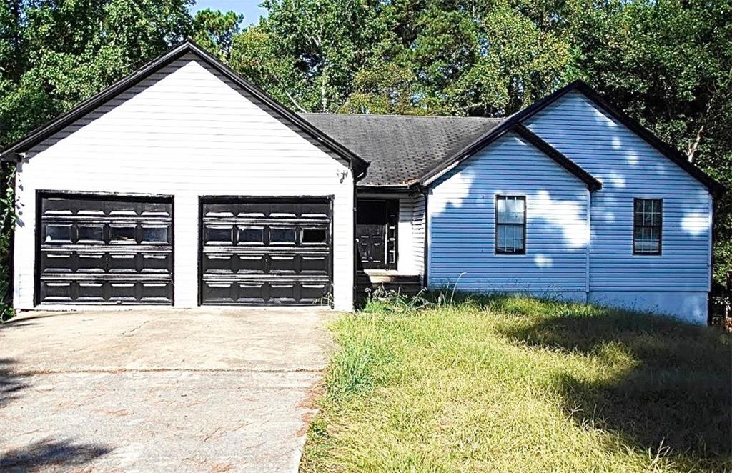 3350 Old Lost Mountain Road Powder Springs, GA 30127 - Photo 1 of 1 a view of a house with wooden fence