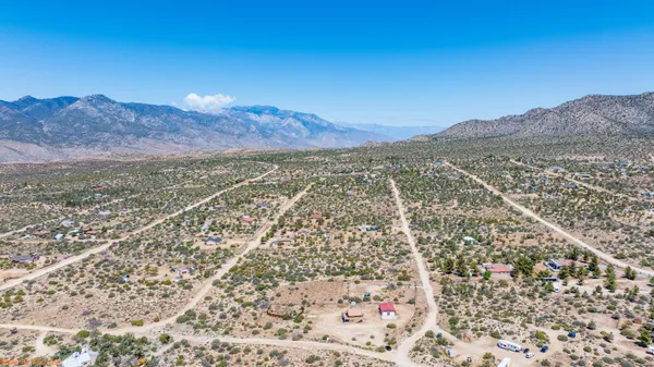 a view of a city with mountains in the background