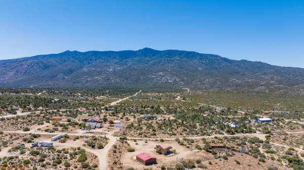 a view of a city with mountains in the background
