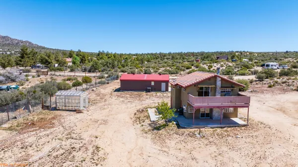 a view of a terrace with a table and chairs