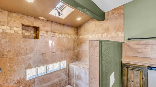 a bathroom with a bathtub and a shower