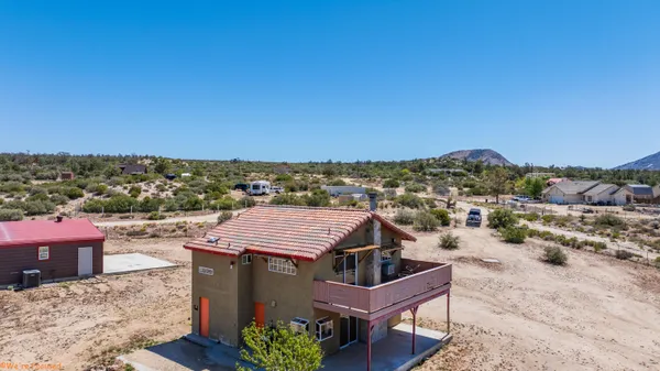 a view of a terrace with sitting area