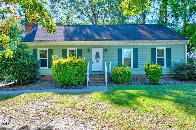 front view of a house with a yard