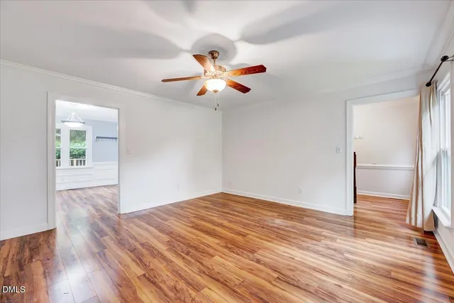 a view of an entryway with wooden floor and door