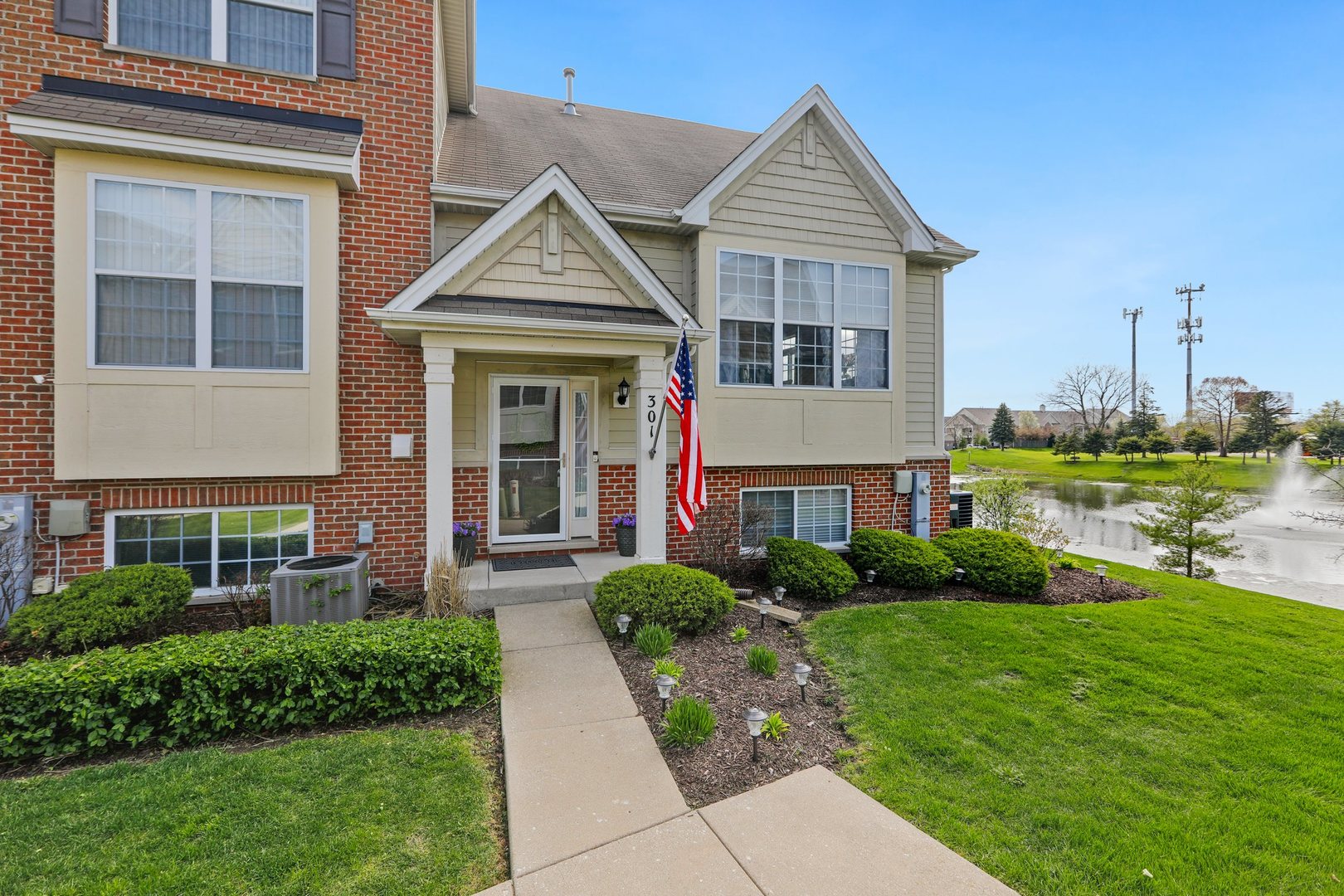 301 Timber Ridge Court Joliet, IL 60431 - Photo 1 of 17 a front view of a house with garden
