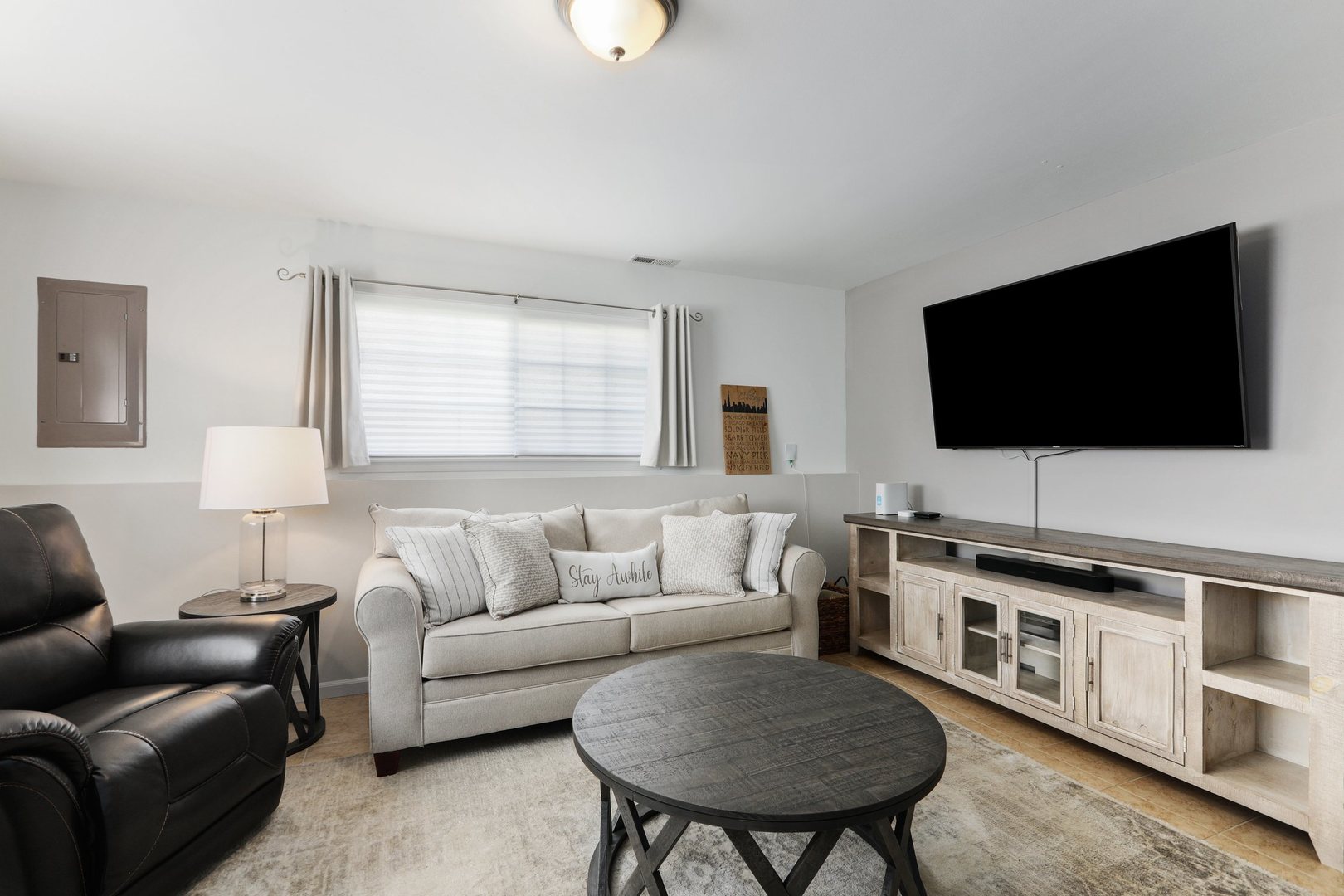 301 Timber Ridge Court Joliet, IL 60431 - Photo 12 of 17 a living room with furniture and a flat screen tv