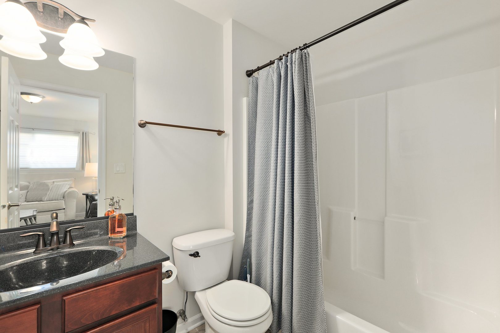 301 Timber Ridge Court Joliet, IL 60431 - Photo 13 of 17 a bathroom with a sink a toilet a mirror and shower
