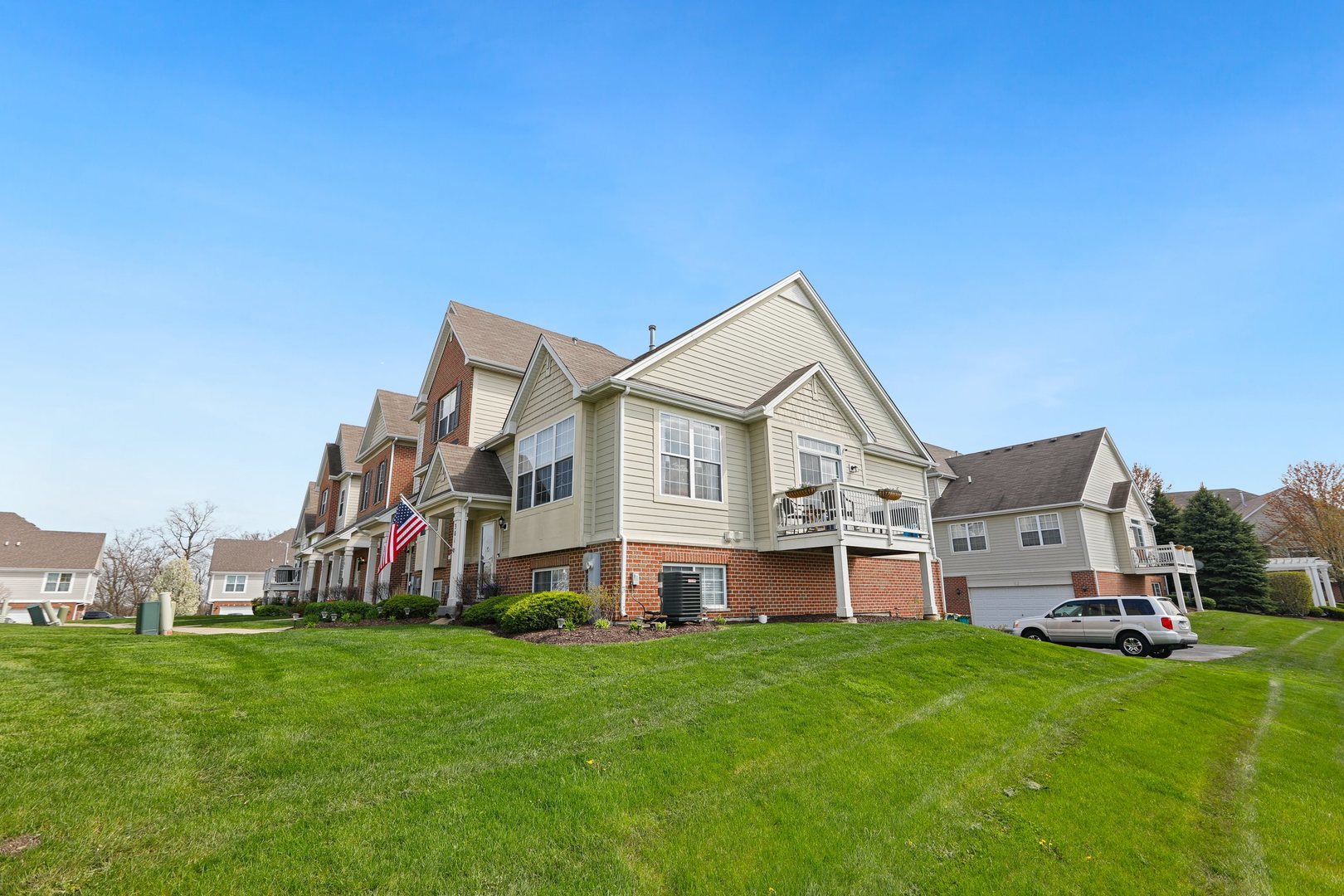 301 Timber Ridge Court Joliet, IL 60431 - Photo 17 of 17 a front view of a house with a garden and yard
