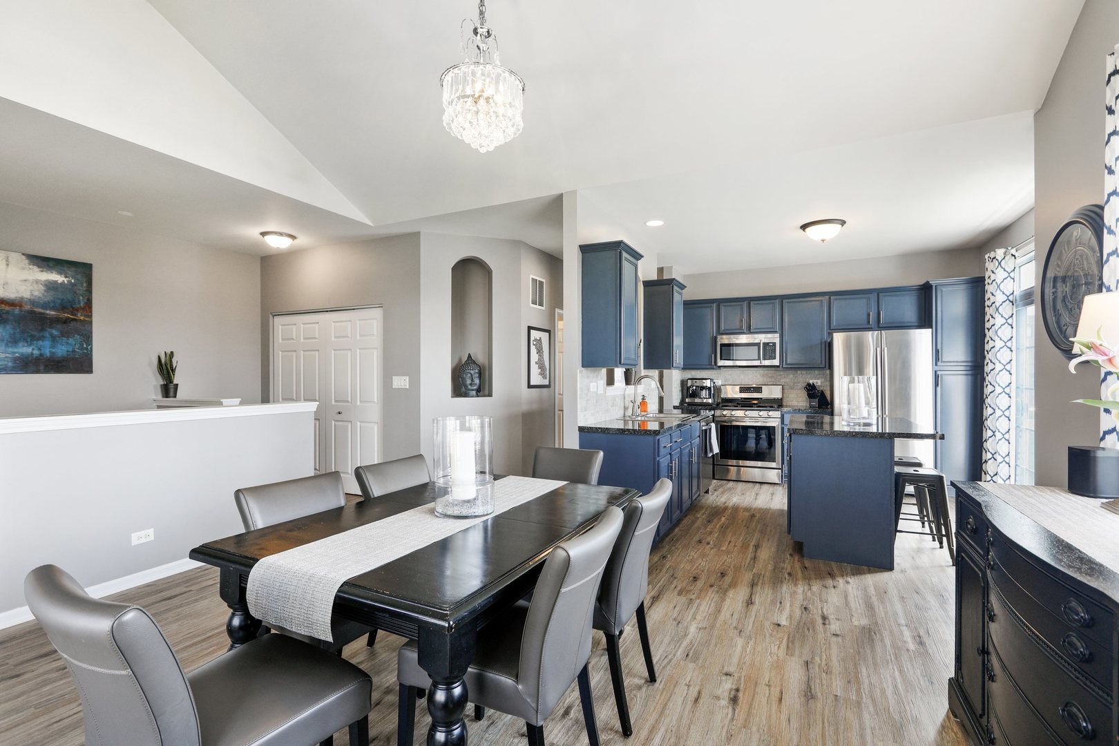 301 Timber Ridge Court Joliet, IL 60431 - Photo 4 of 17 a view of a dining room with furniture and wooden floor
