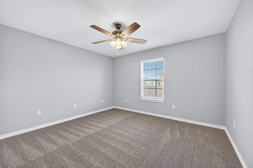 1021 Rice Street, Unit 101 Denison, TX 75020 - Photo 16 of 22 a view of an empty room with a window