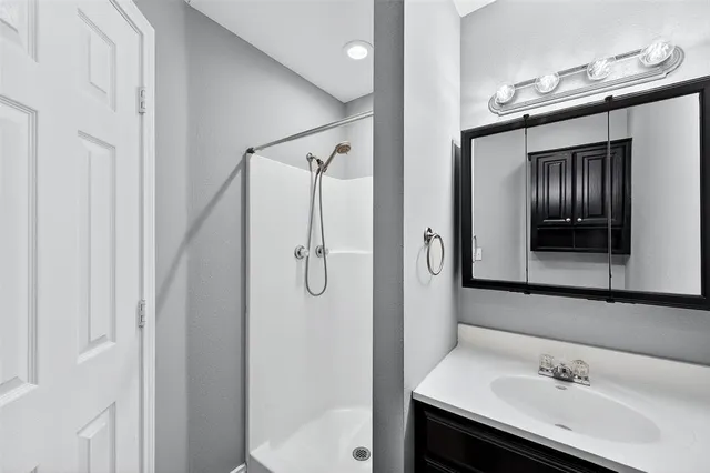 a bathroom with a sink and mirror