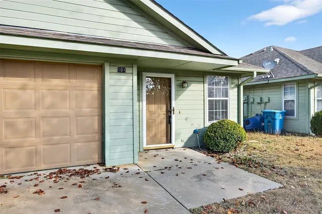 a view of a entryway door front of a house