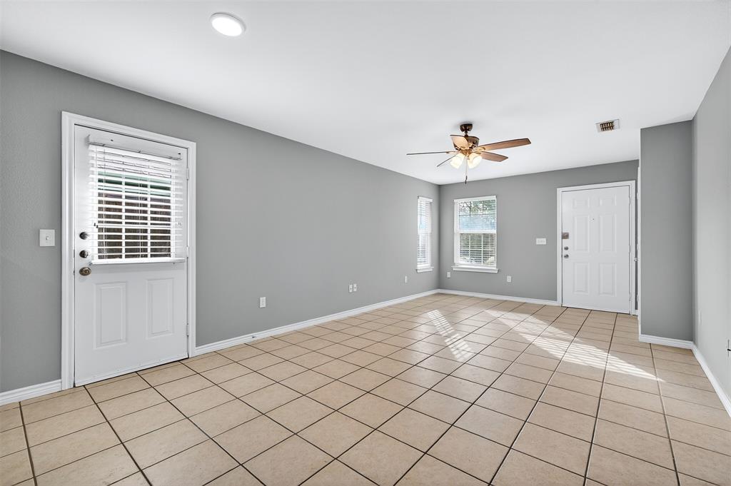 1021 Rice Street, Unit 101 Denison, TX 75020 - Photo 5 of 22 a view of an empty room with a window
