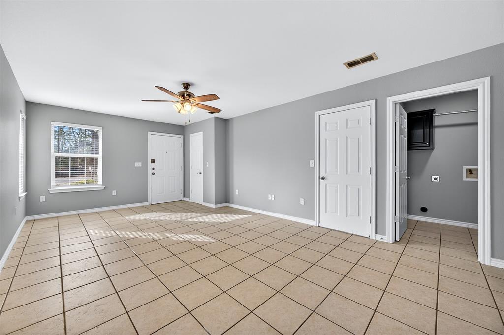 1021 Rice Street, Unit 101 Denison, TX 75020 - Photo 7 of 22 a view of an empty room and window