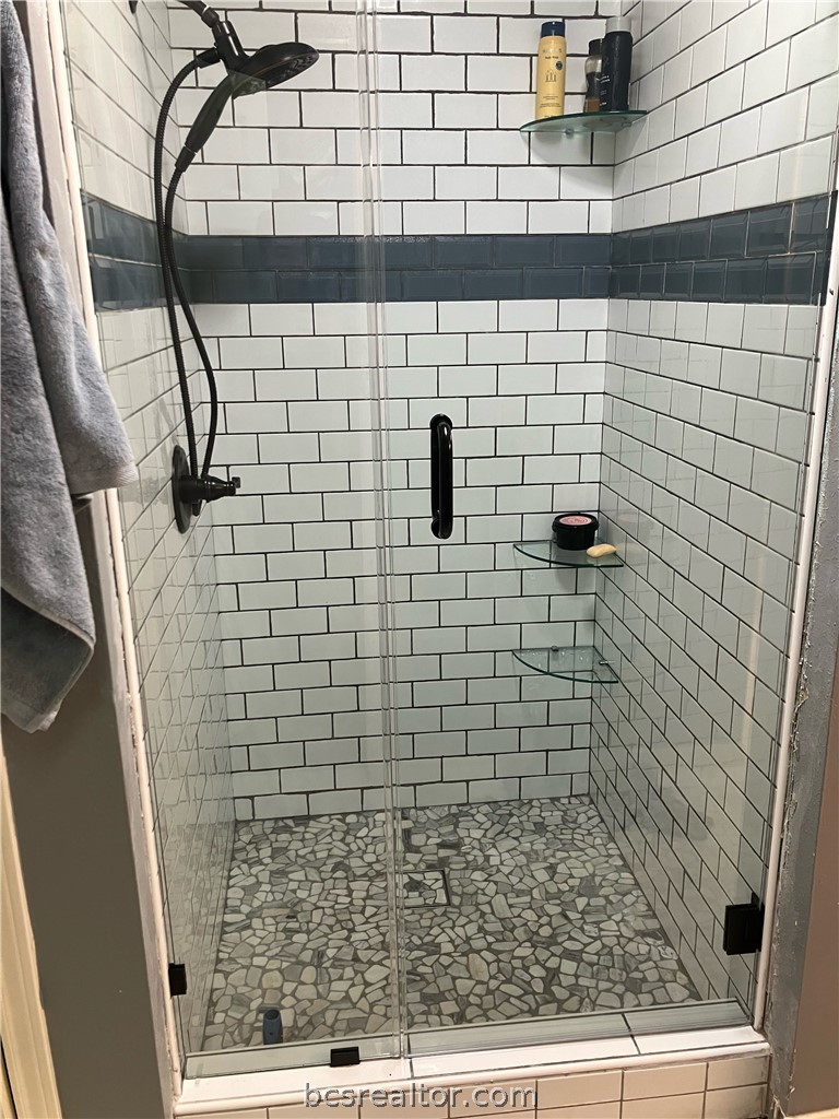 5660 Falling Water Bryan, TX 77808 - Photo 10 of 27 Bathroom featuring walk in shower