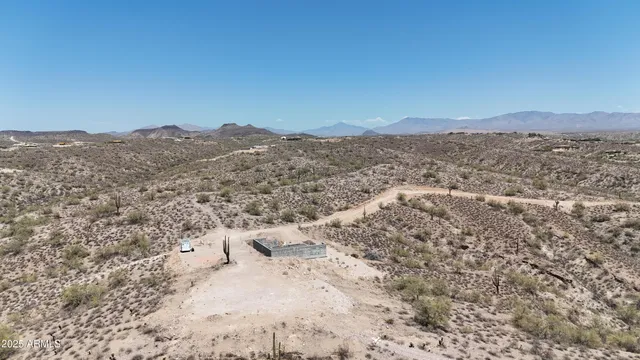 a view of a lake with mountains in the background
