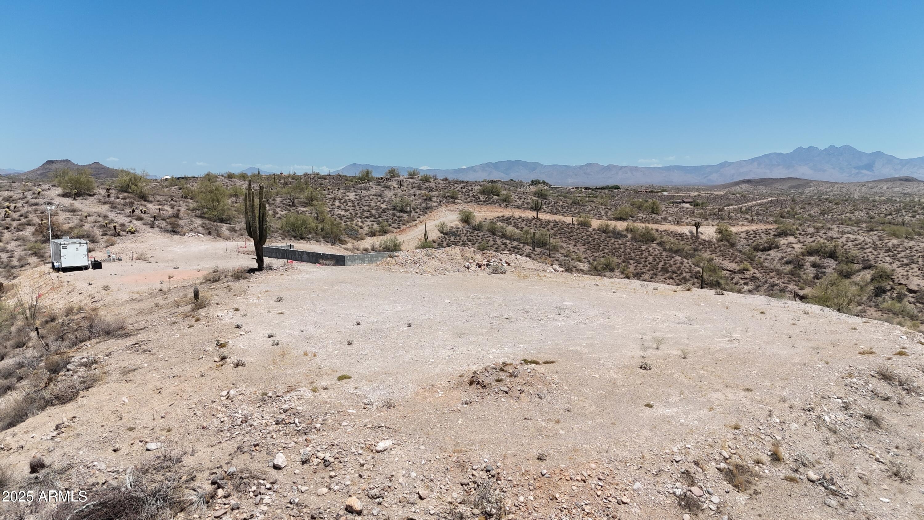 12906 North Goldfield Road, Unit 3T Fort McDowell, AZ 85264 - Photo 9 of 28 a view of a dry yard with mountains in the background