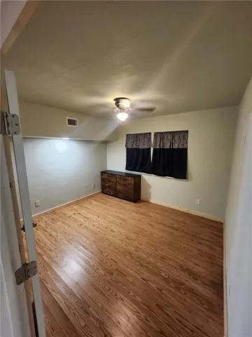 a room with a bed and window