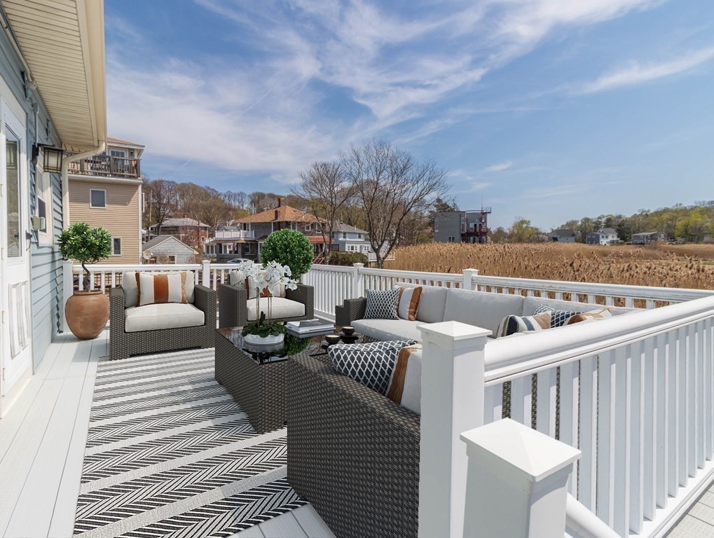 36 Ocean Avenue, Unit OCEAN VIEW Hull, MA 02045 - Photo 14 of 38 a view of a balcony with couches and city view
