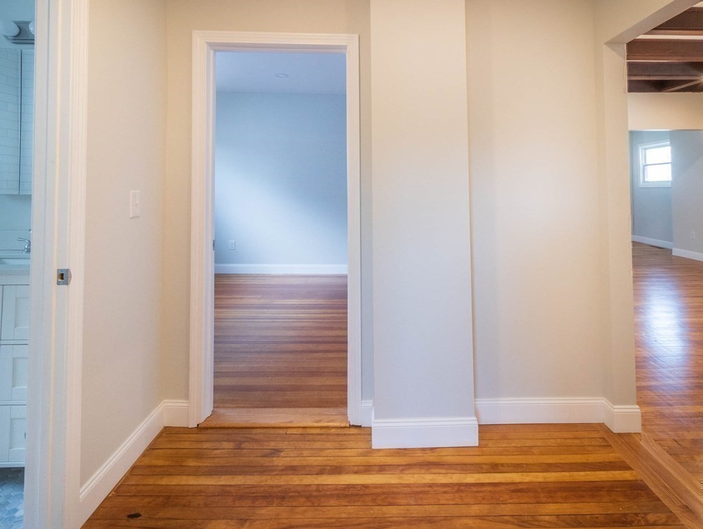 36 Ocean Avenue, Unit OCEAN VIEW Hull, MA 02045 - Photo 19 of 38 a view of room with wooden floor