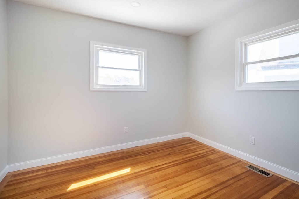 36 Ocean Avenue, Unit OCEAN VIEW Hull, MA 02045 - Photo 24 of 38 a view of a room with wooden floor and fan