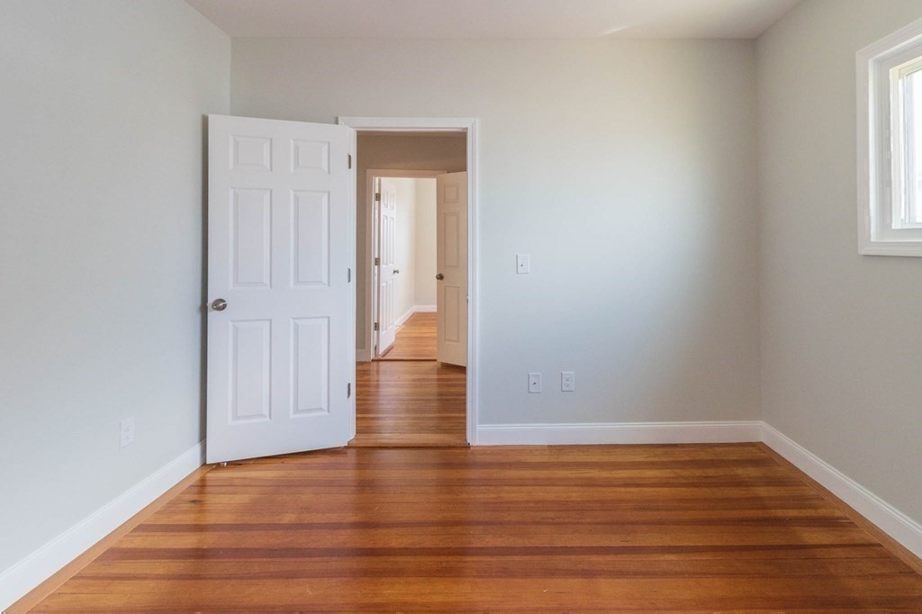 36 Ocean Avenue, Unit OCEAN VIEW Hull, MA 02045 - Photo 30 of 38 a view of wooden floor and windows in a room