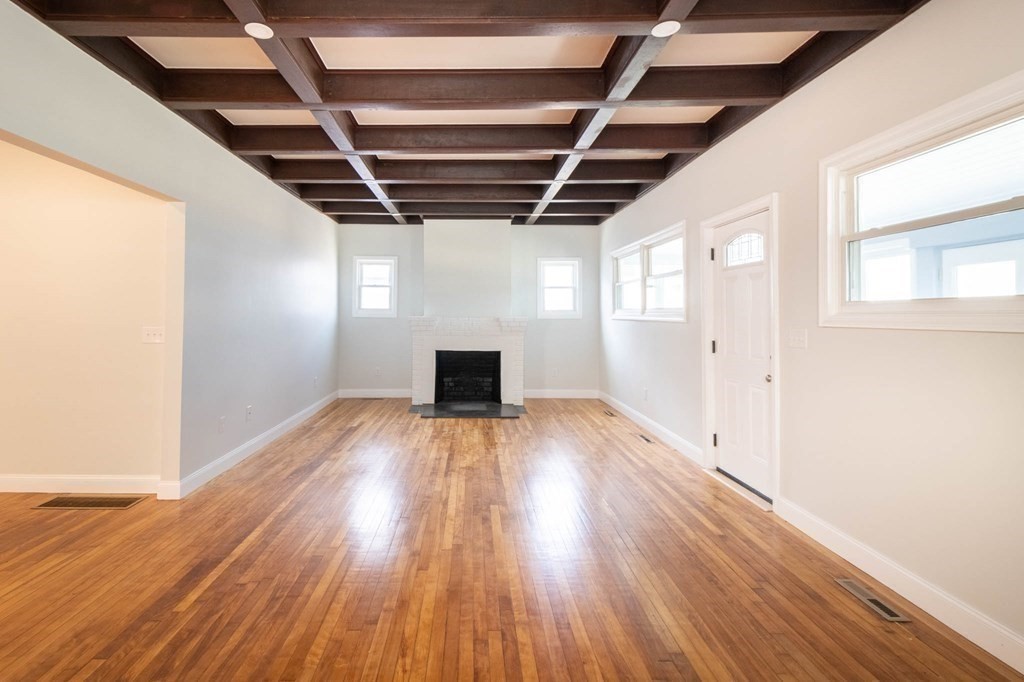 36 Ocean Avenue, Unit OCEAN VIEW Hull, MA 02045 - Photo 9 of 38 a view of empty room with wooden floor