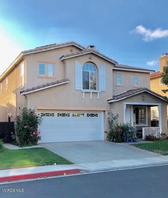 757 Navigator Way Oxnard, CA 93035 - Photo 1 of 23 a front view of a house with a yard and garage