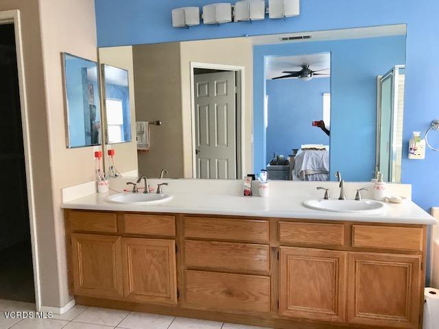 757 Navigator Way Oxnard, CA 93035 - Photo 13 of 23 a bathroom with a sink and a mirror