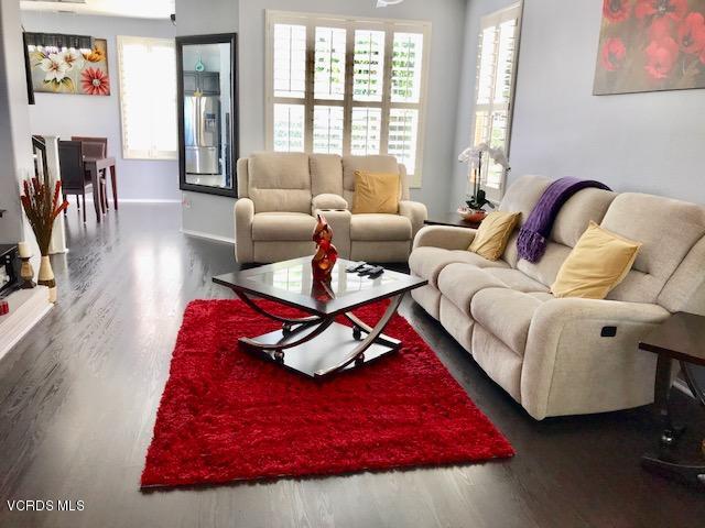 757 Navigator Way Oxnard, CA 93035 - Photo 4 of 23 a living room with furniture rug and wooden floor