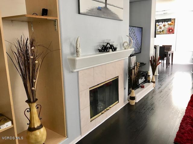 757 Navigator Way Oxnard, CA 93035 - Photo 6 of 23 a living room with furniture and a fireplace