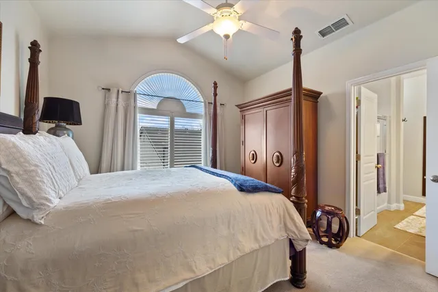 a bathroom with a double vanity sink and a large mirror