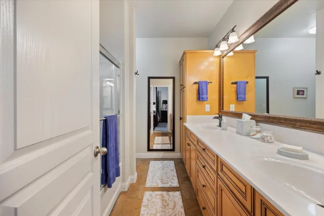 a white toilet sitting next to a white wall