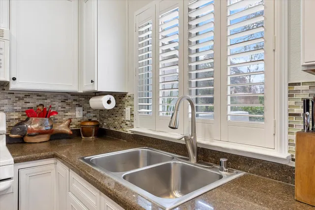 a kitchen with a sink and a window