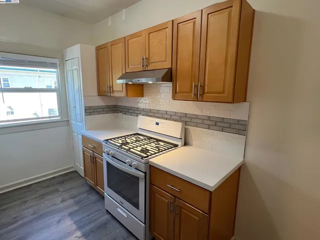 a kitchen with a stove and a microwave