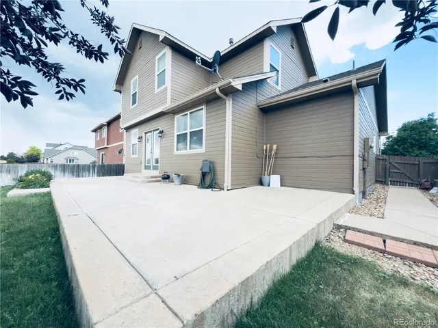 a white house with a large outdoor space