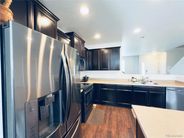 a large kitchen with a large counter top space