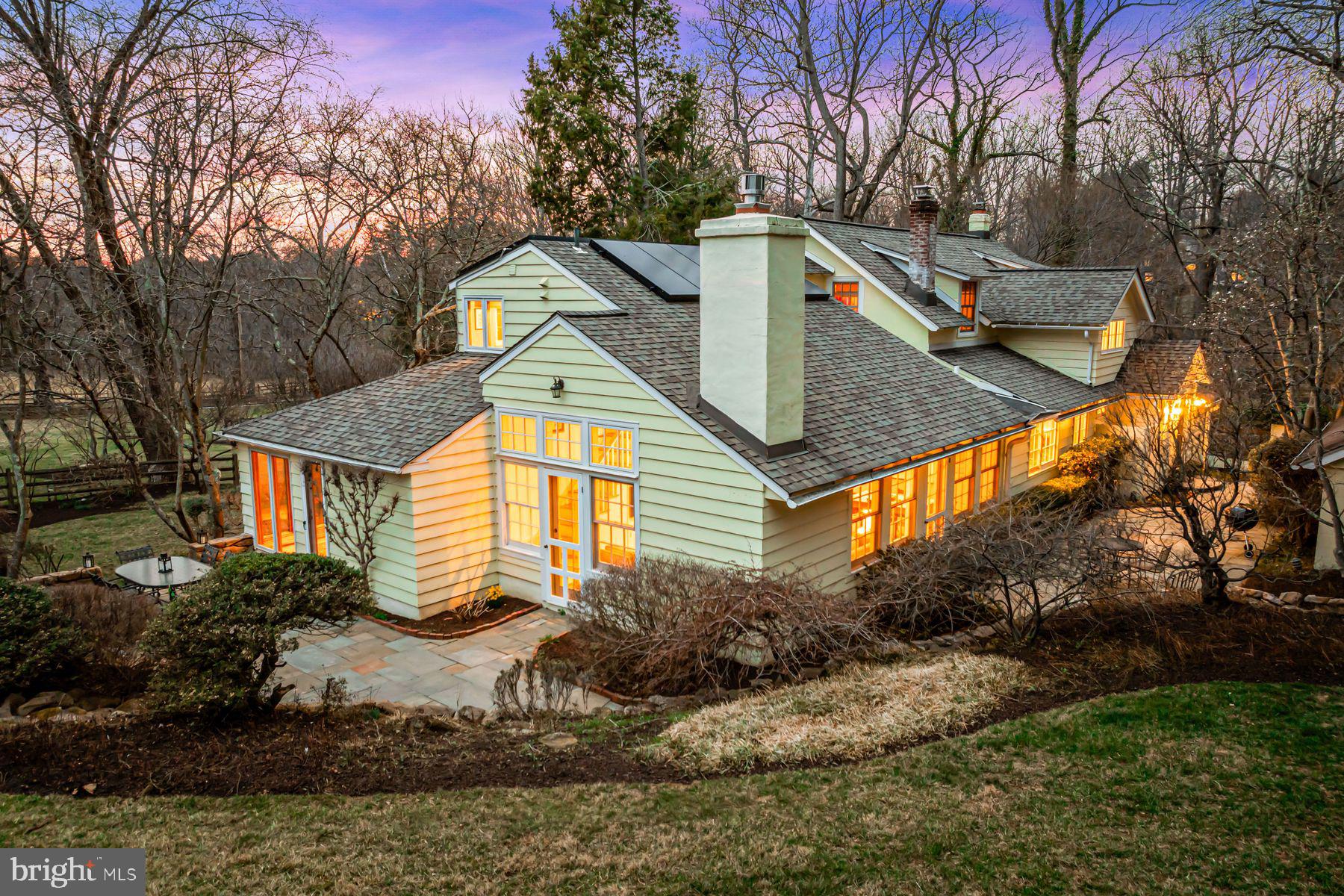 385 Church Road Devon, PA 19333 - Photo 2 of 59 a front view of house with yard and trees around