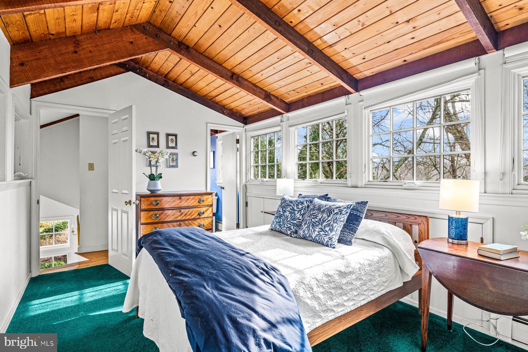 385 Church Road Devon, PA 19333 - Photo 42 of 59 a bedroom with a bed and a large window with outer view