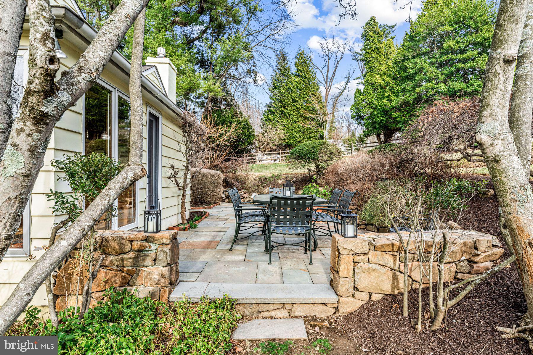 385 Church Road Devon, PA 19333 - Photo 54 of 59 a view of a patio with couches table and chairs and potted plants
