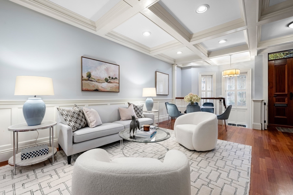 a living room with furniture and a rug