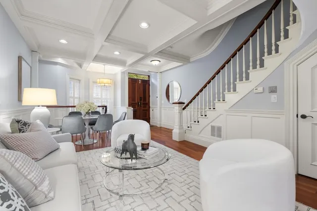 a living room with furniture flowerpot and a table