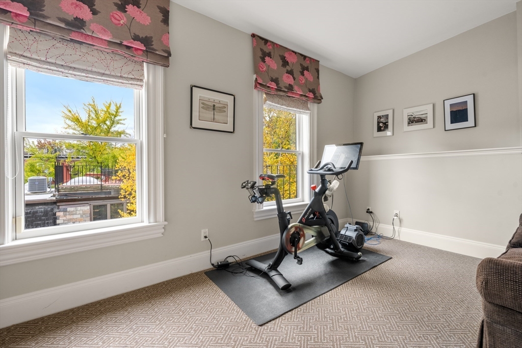 44 Appleton Street Boston, MA 02116 - Photo 22 of 33 a room with gym equipment and a window