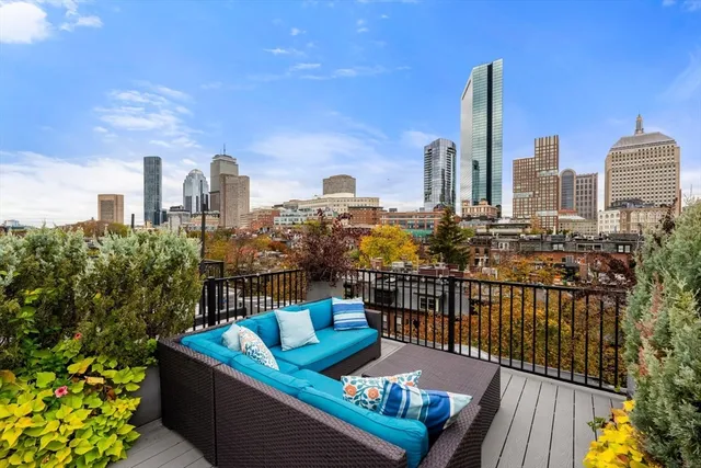 a view of a balcony with two chairs and a table