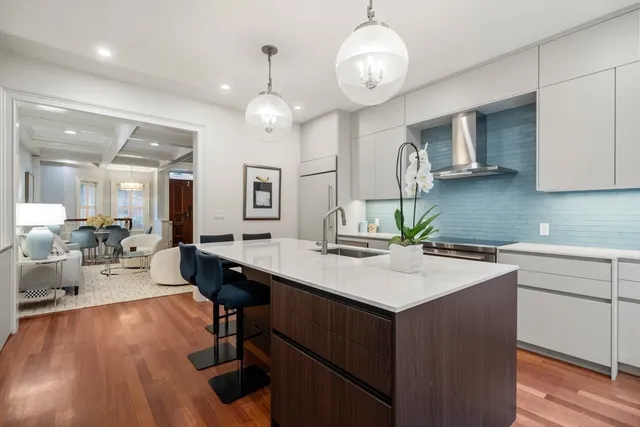 a kitchen with a counter space cabinets and appliances