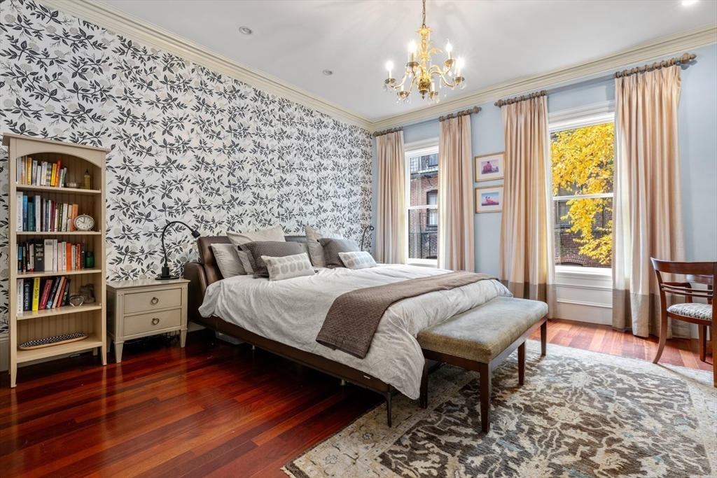 44 Appleton Street Boston, MA 02116 - Photo 8 of 33 a bedroom with a bed and a book shelf